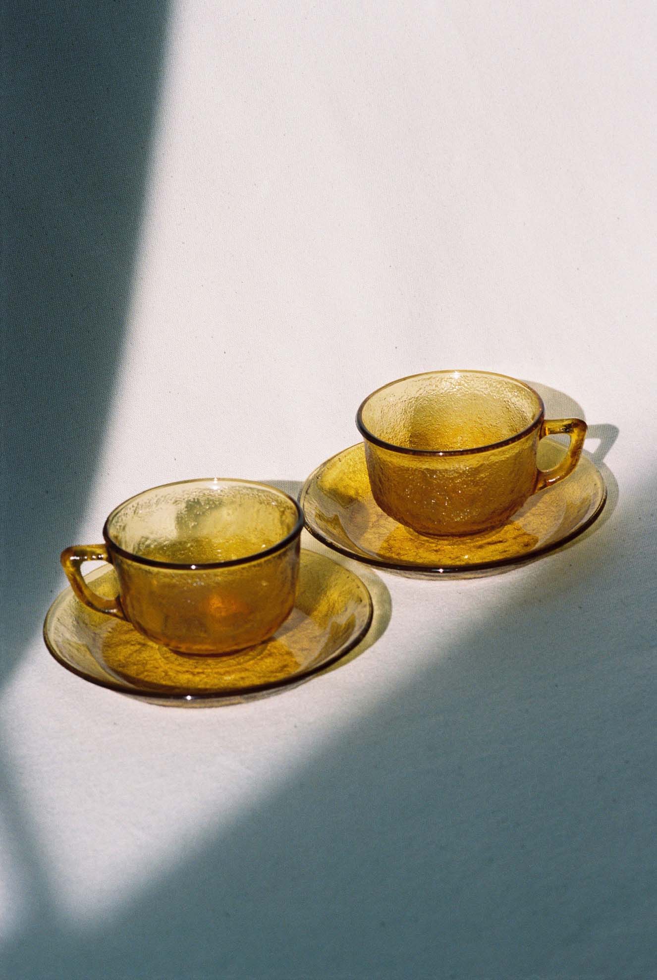 Arcoroc Amber Cup and Saucer Set available for prop hire in Cape Town