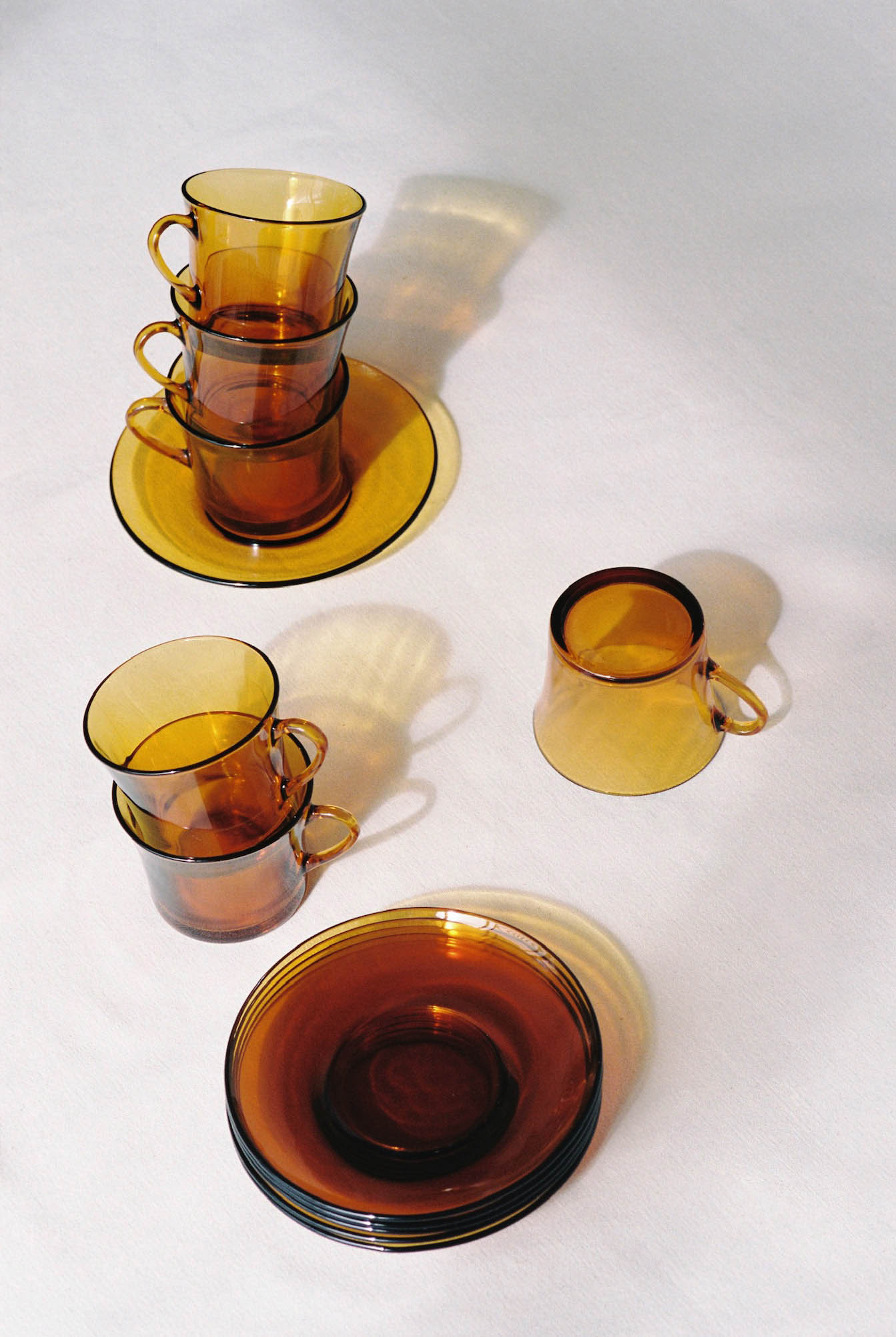 Duralex Amber Cups and Saucers available for prop hire in Cape Town